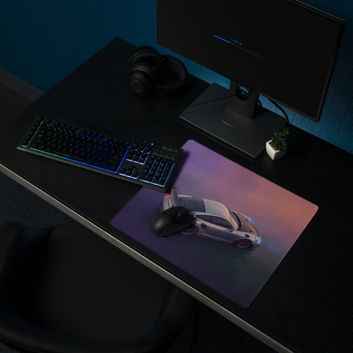 A sleek rectangular Porsche 911 GT3 RS inspired aerial edition desk mat with vibrant gradient and illuminated sports car design
