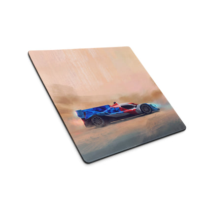 A rectangular smooth tracking mousepad featuring a vibrant blue and red bmw m hybrid v8 racing car in a desert