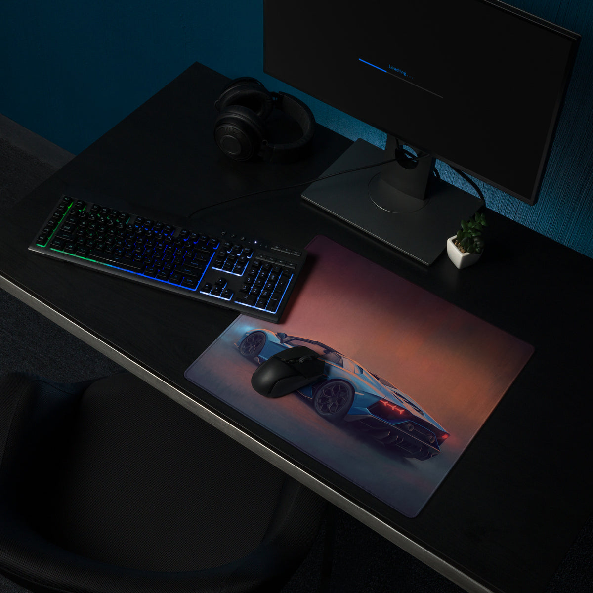 A sleek rectangular non-slip rubber gaming mousepad featuring a blue sports car graphic and orange purple gradient background