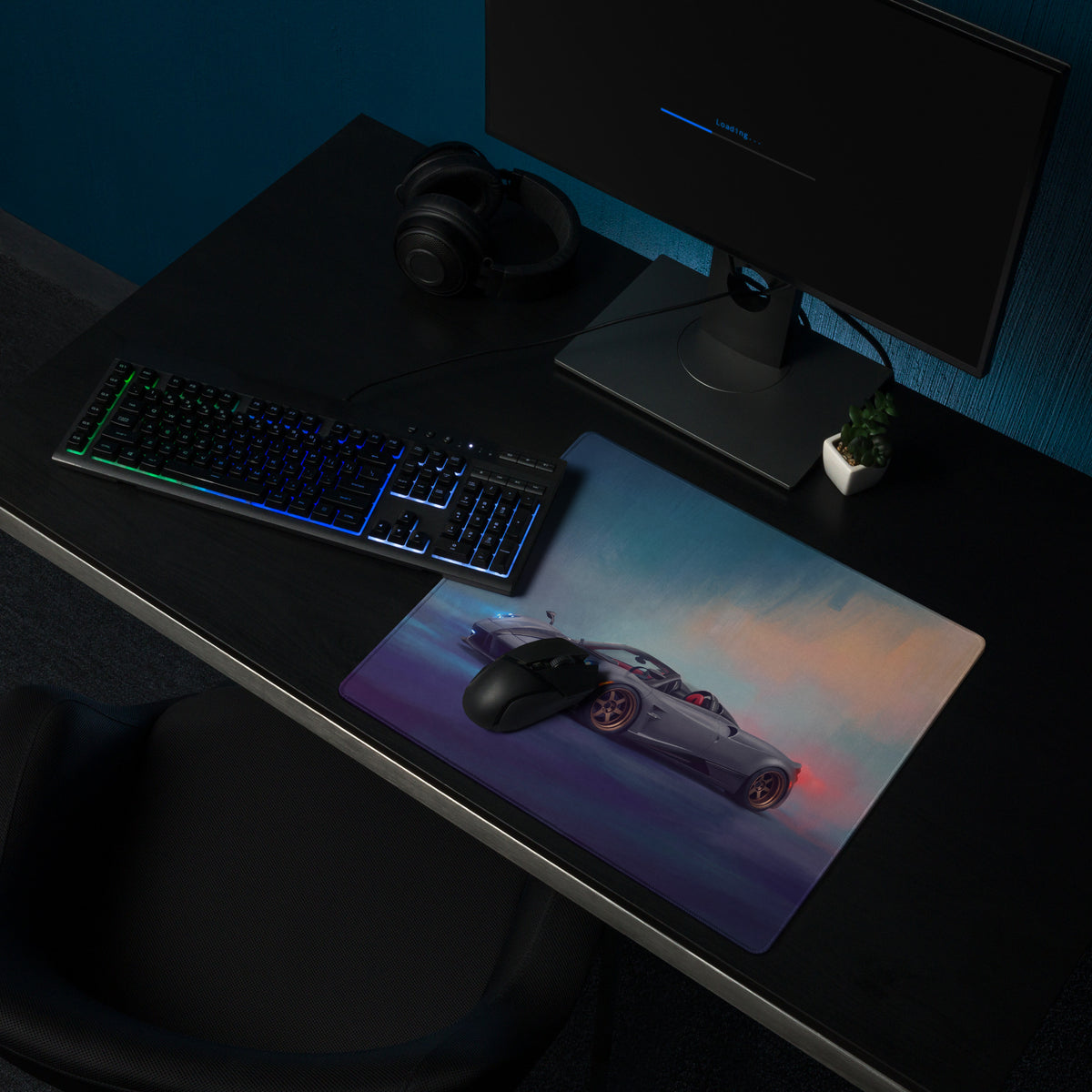 A sleek rectangular pagani huayra r inspired gold leaf desk pad with vibrant silver sports car graphic and stitched edge