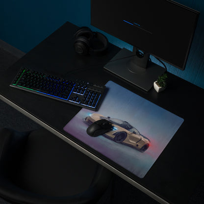 A sleek rectangular mclaren 720s inspired sahara gold gaming mousepad with beige car and glowing blue and red accents