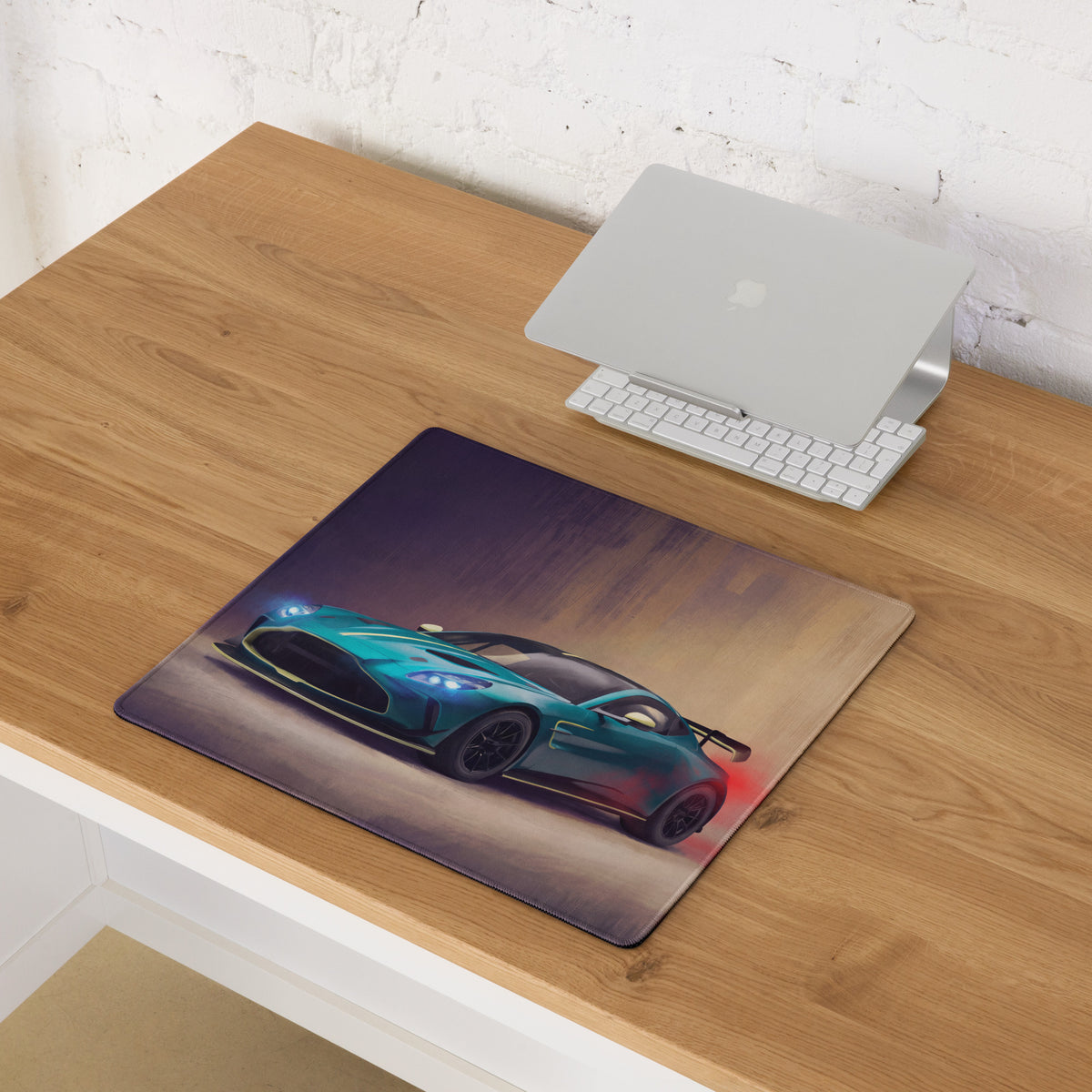 Rectangular non-slip rubber mousepad featuring vibrant teal Aston Martin Vantage with glowing blue headlights