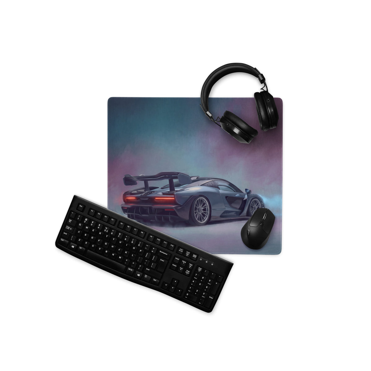 McLaren Senna inspired apex stealth desk pad with sleek dark gray car graphic and subtle gradient background
