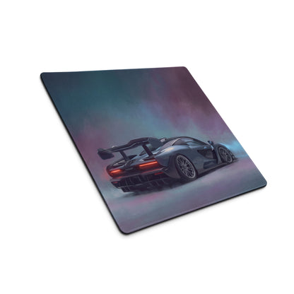 A sleek rectangular ultra-glide xl gaming mouse mat featuring a dark gray mclaren senna with red taillights on a purple teal background