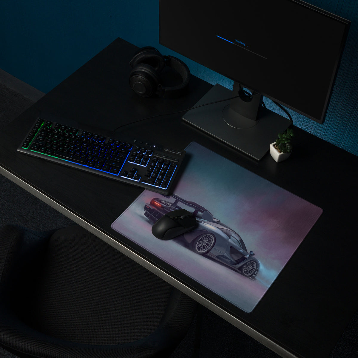A sleek rectangular ultra-glide xl gaming mouse mat featuring a silver mclaren senna car with glowing red rear accents