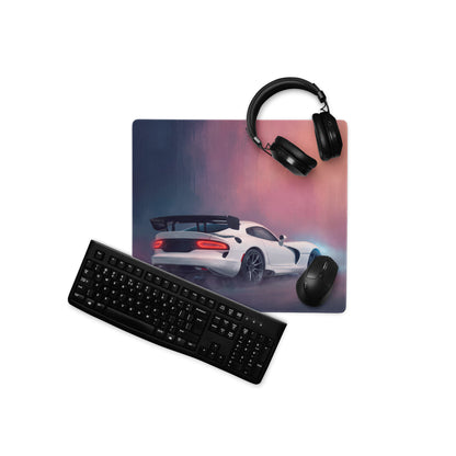 Dodge Viper ACR inspired pure white sports car graphic desk pad with extended stitched edge, black headphones, and keyboard nearby