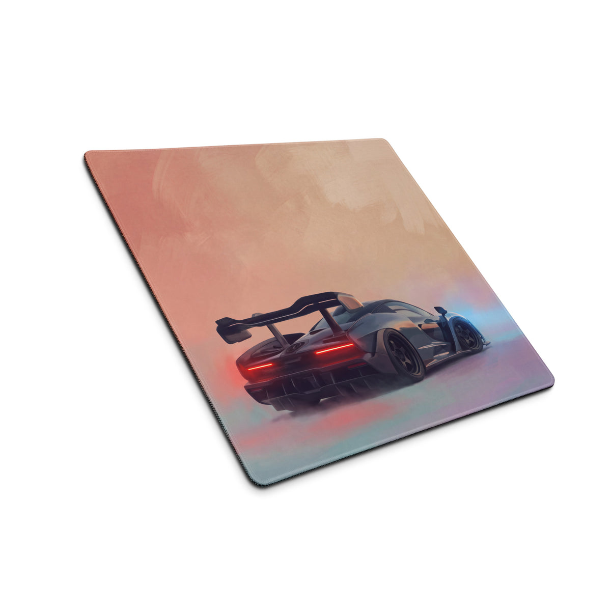 A sleek rectangular mousepad with a futuristic gray sports car illustration on a non slip rubber base desk pad