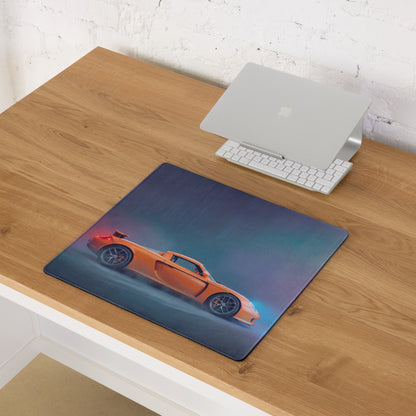 Orange sports car graphic on dark blue rectangular porsche carrera gt inspired sunset orange desk mat mousepad
