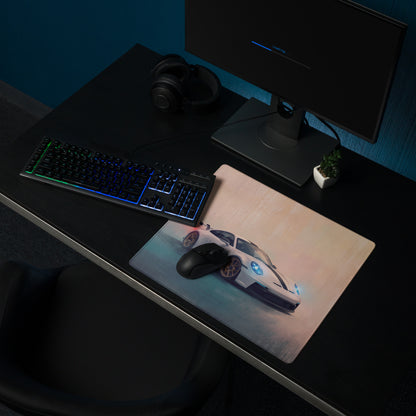 A sleek rectangular porsche 911 gt3 inspired white gold desk pad featuring a white sports car graphic with blue accents and black racing stripes on a non slip rubber base