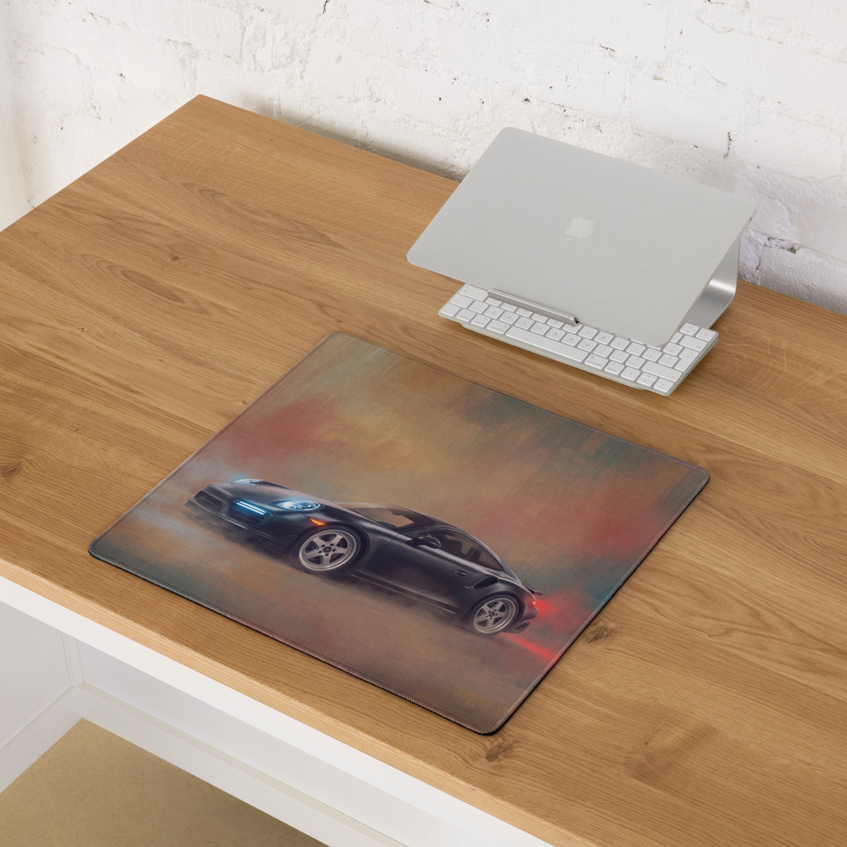 Black Porsche sports car graphic printed on rectanglular slate grey stitched desk mat for high precision gaming