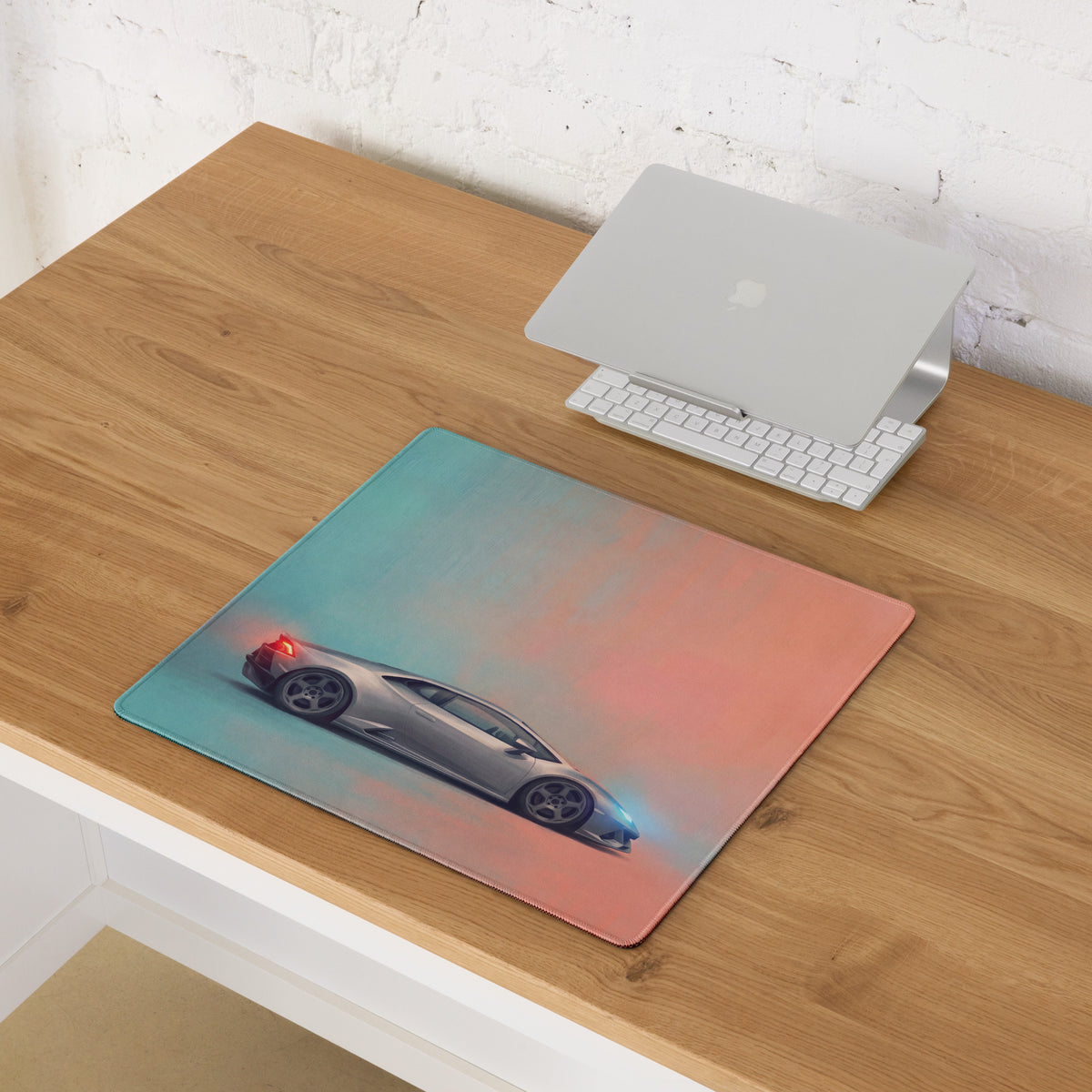 Silver Lamborghini Huracán inspired sports car graphic on a gradient blue to pink ultra-glide cloth desk mat mousepad