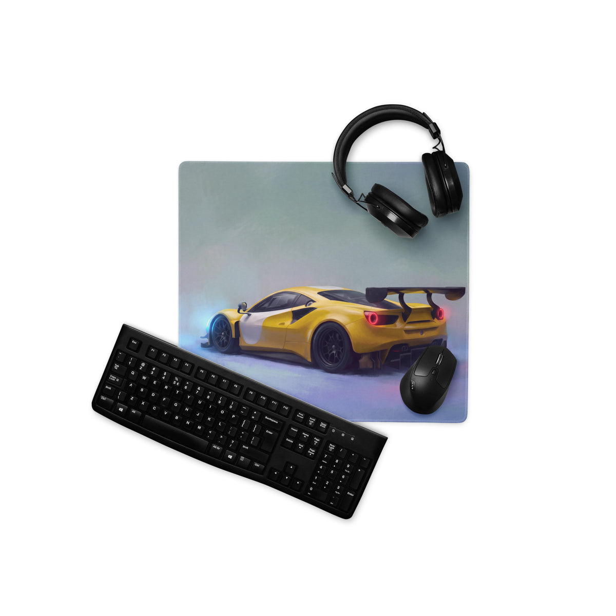 Yellow and white ferrari 488 gt3 inspired modena circuit desk pad with stitched edge on gaming setup with keyboard mouse and headphones
