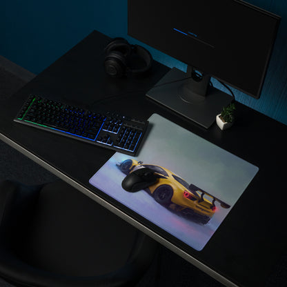 Yellow sports car graphic ferrari 488 gt3 inspired modena circuit desk pad with black gaming mouse on top