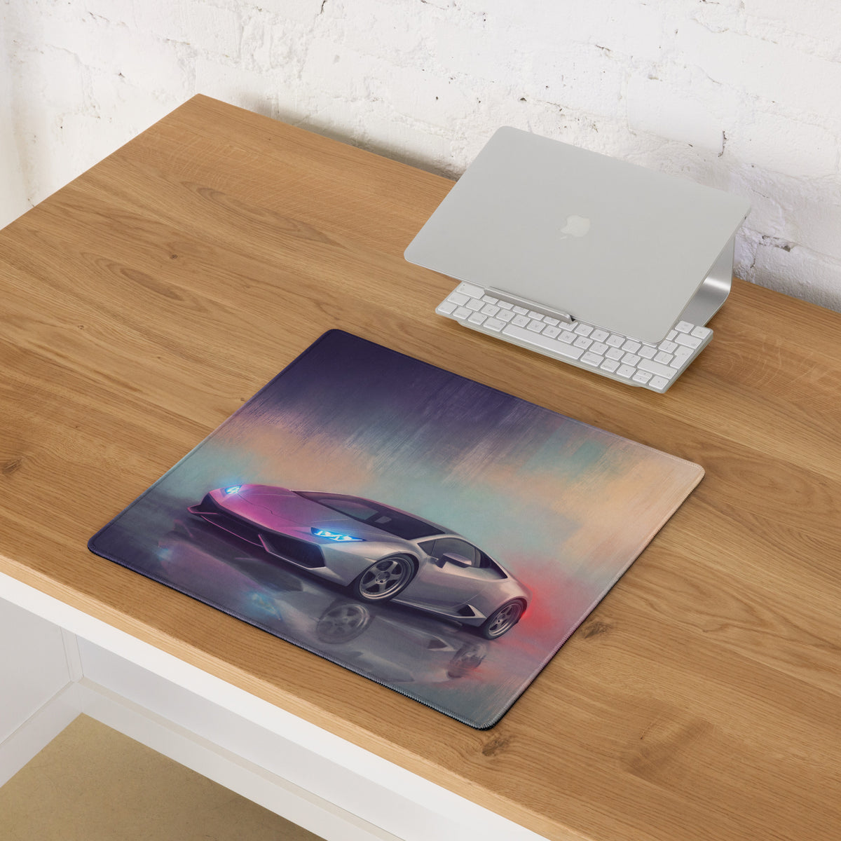 A rectangular ultra-glide cloth desk mat featuring a vibrant silver lamborghini huracán with glowing blue headlights and red accents