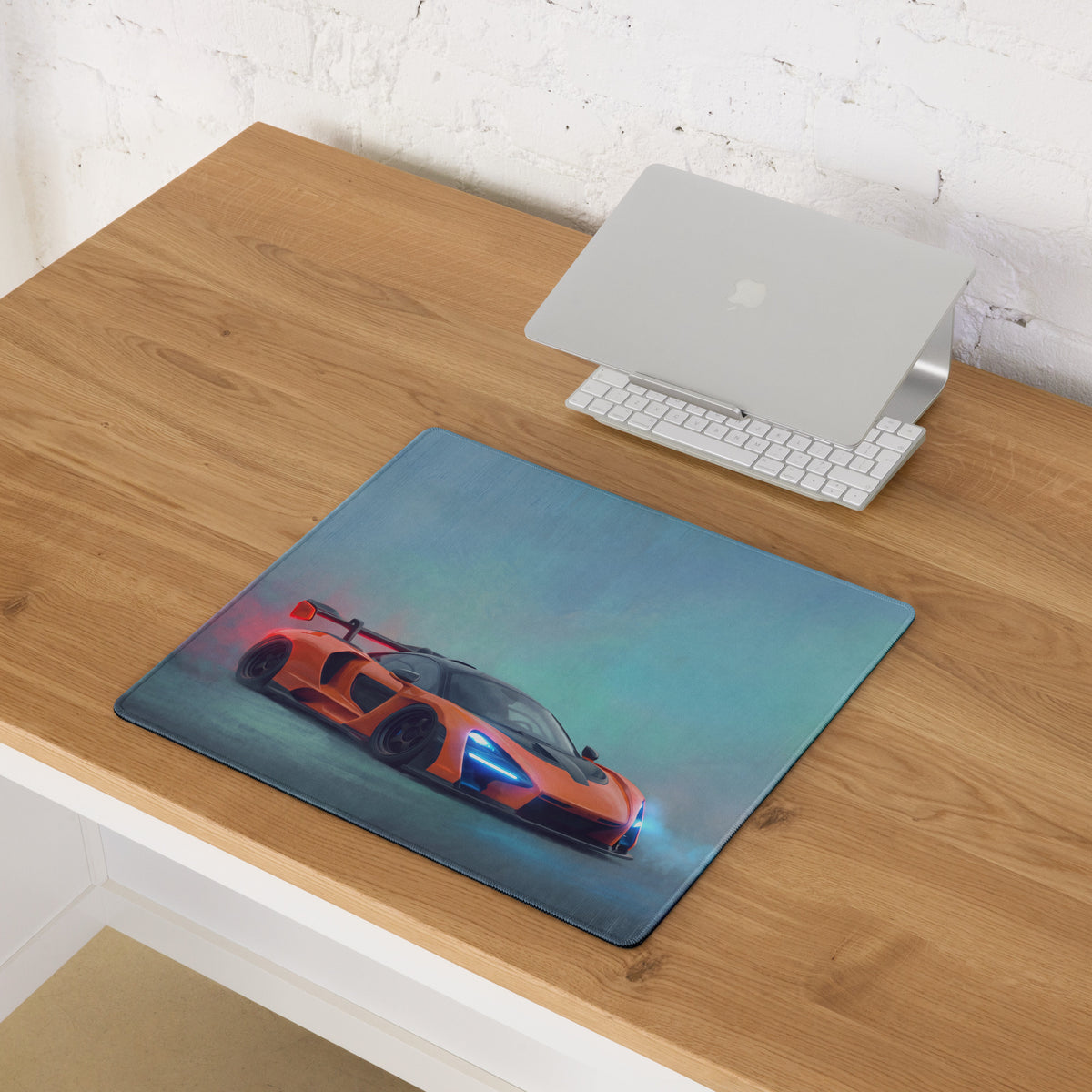 Mclaren senna inspired papaya orange sports car graphic printed on rectangular stitched edge gaming mousepad with blue gradient background