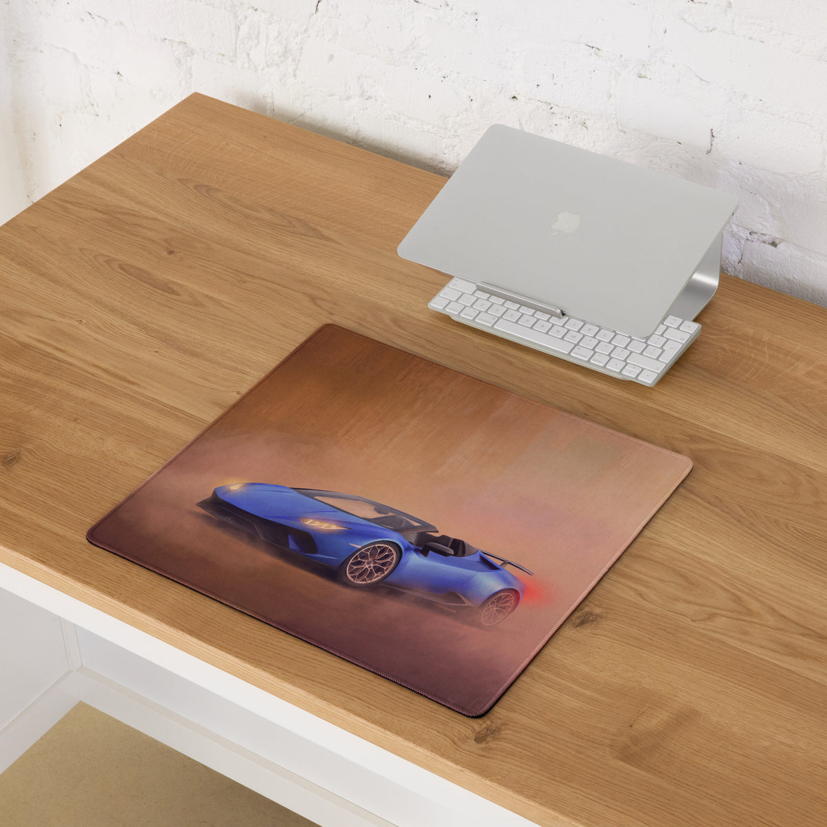 Lamborghini huracán spyder inspired cobalt sunset desk mat with blue sports car graphic on a brown gradient background