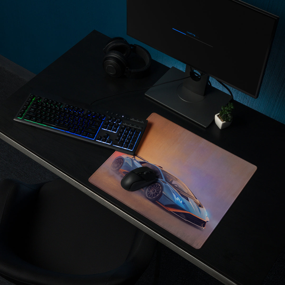 A sleek rectangular non-slip desk pad featuring a vibrant blue and orange Lamborghini Huracán STO sports car graphic