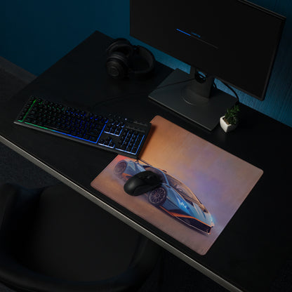 A sleek rectangular non-slip desk pad featuring a vibrant blue and orange Lamborghini Huracán STO sports car graphic