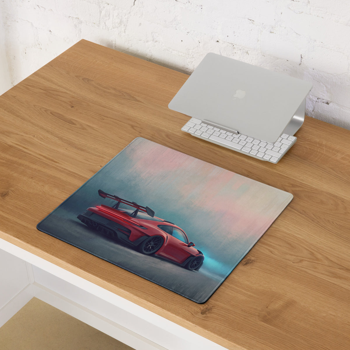 Porsche 911 gt3 rs inspired crimson apex desk mat with red sports car graphic and black racing wheels on xl gaming mousepad
