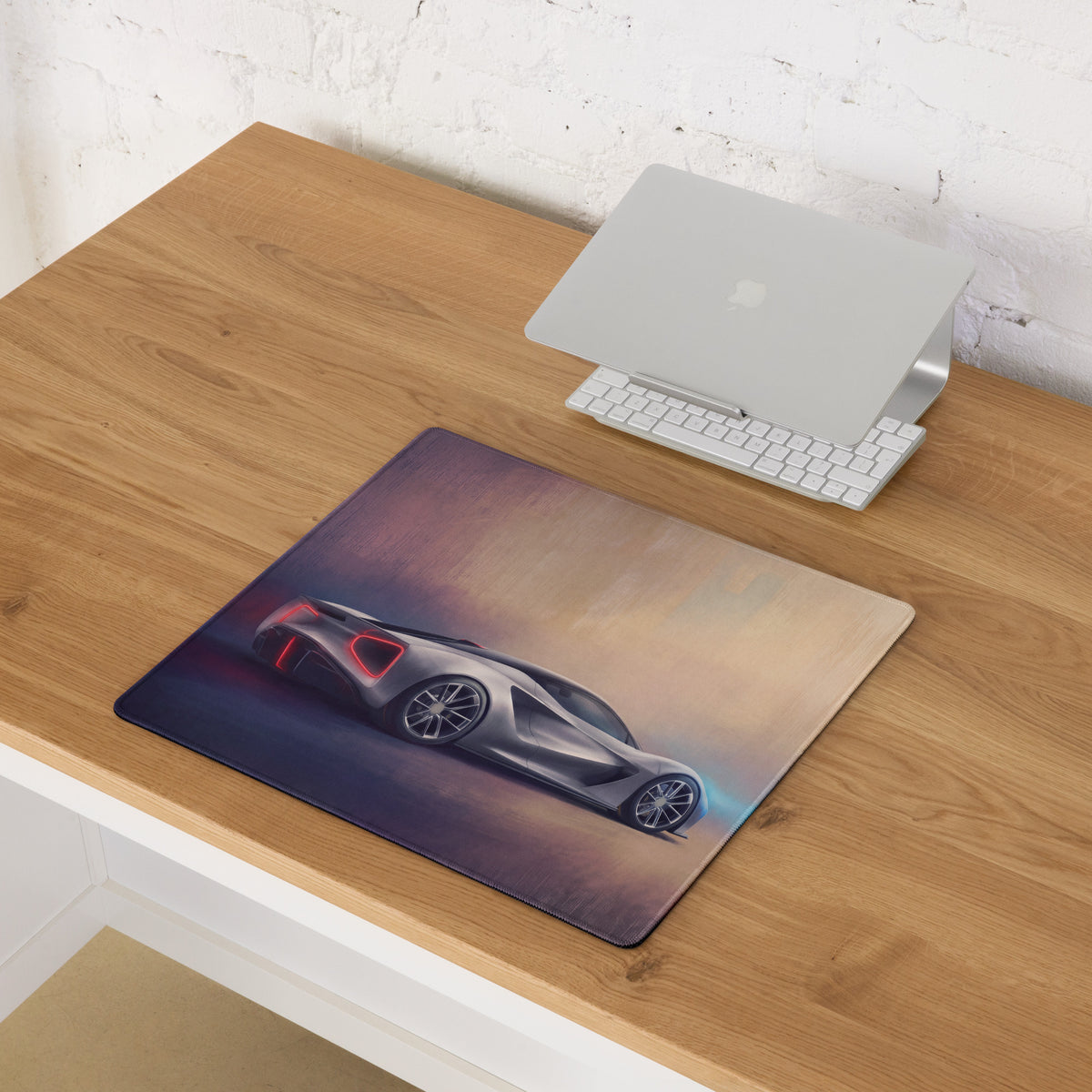 Rectangular low-friction cloth desk mat featuring a high detail silver Lotus Evija inspired sports car on gradient background