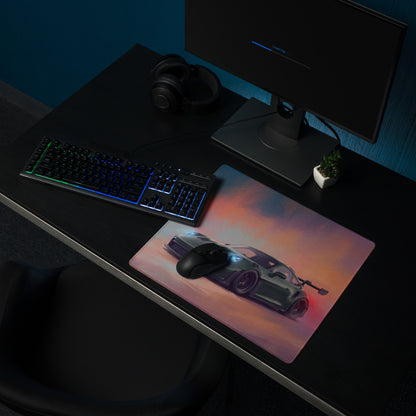 A sleek rectangular extended non slip porsche 911 gt3 rs inspired desk pad with a silver sports car graphic
