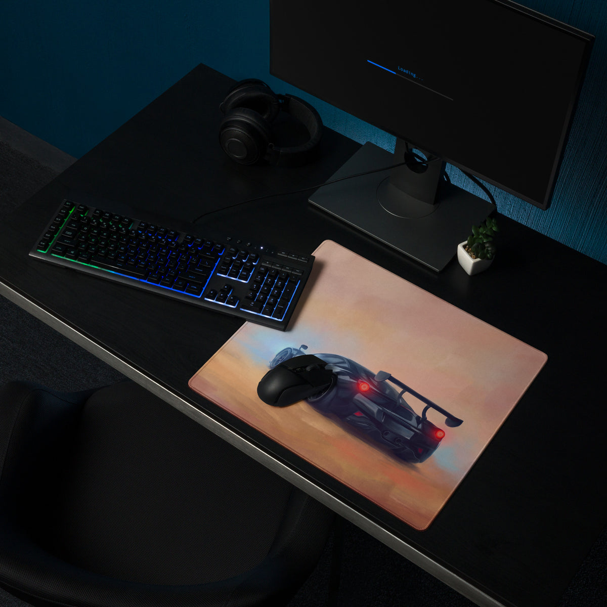 A rectangular high-precision xl gaming mousepad featuring a dark gray mclaren senna with red taillights on a papaya sunset background