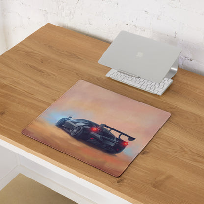 Rectangular McLaren Senna inspired papaya sunset desk mat with black sports car red taillights and blue smoke effects on orange gradient