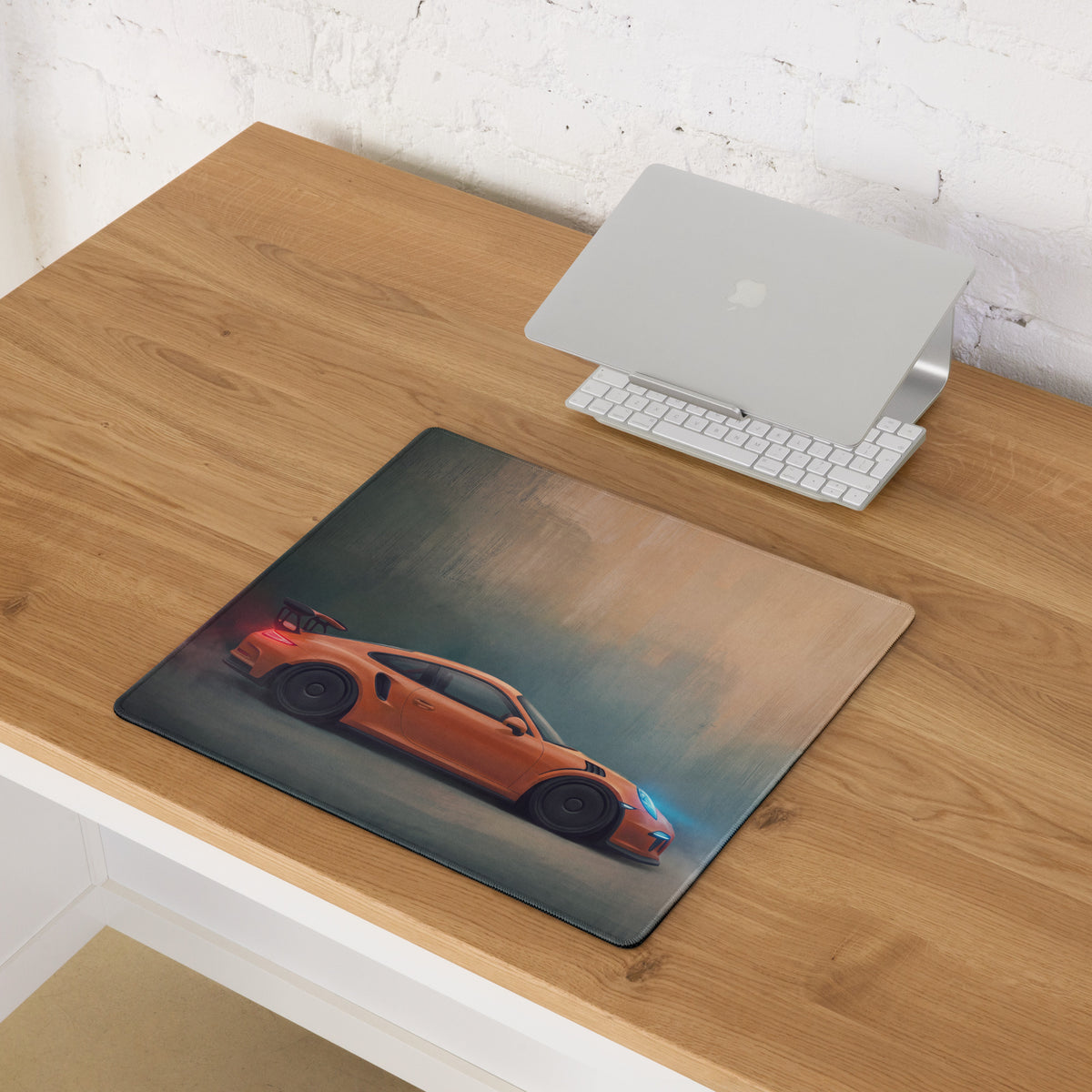 Porsche 911 gt3 rs inspired lava orange desk mat with orange sports car graphic on low friction textured cloth surface