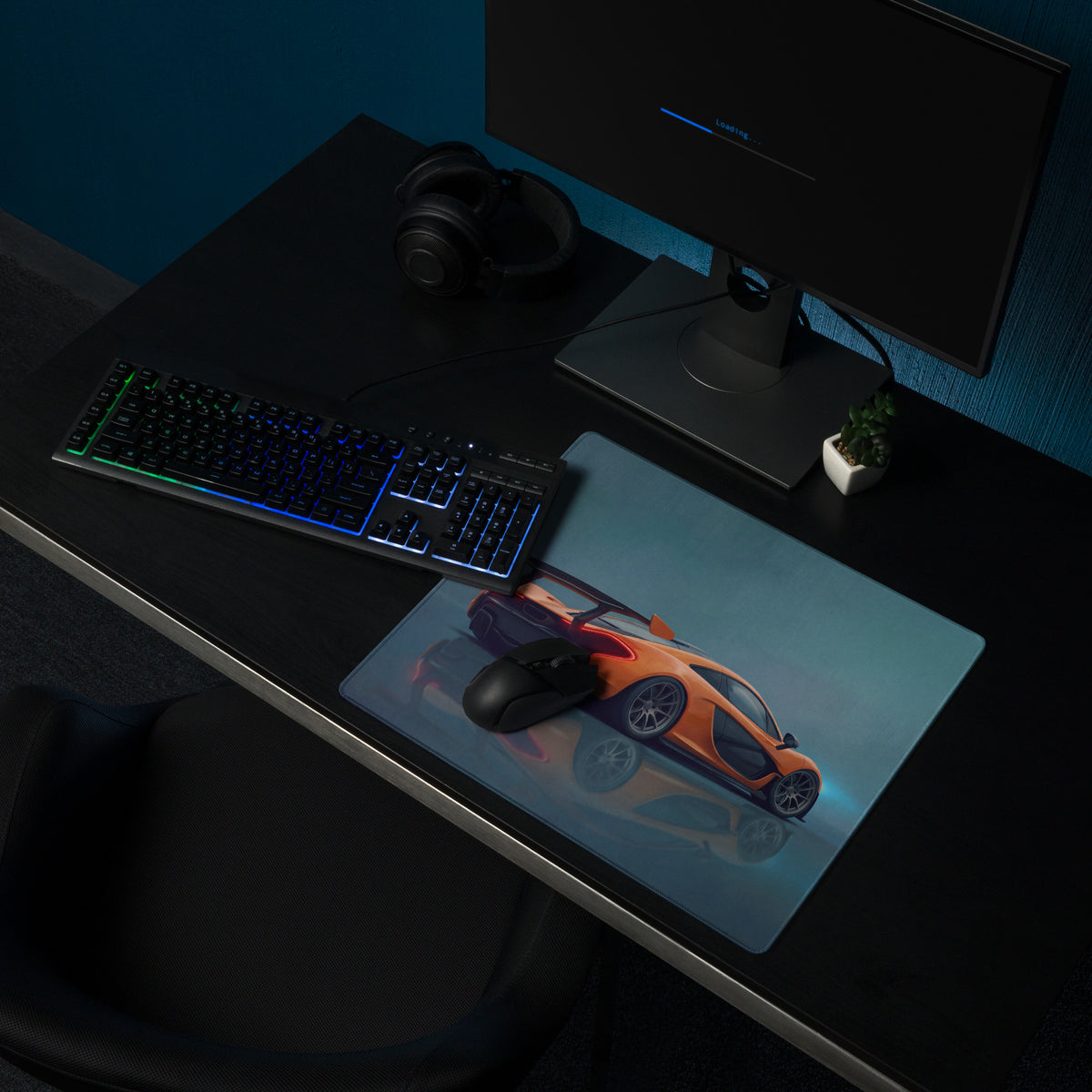 Orange mclaren sports car graphic printed on a volcano orange low-friction cloth desk mat mousepad