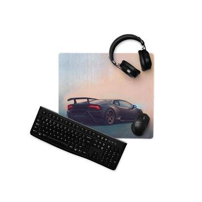 Black xl gaming mousepad with a glossy dark gray Lamborghini Huracán image and red taillights on a gradient sky background