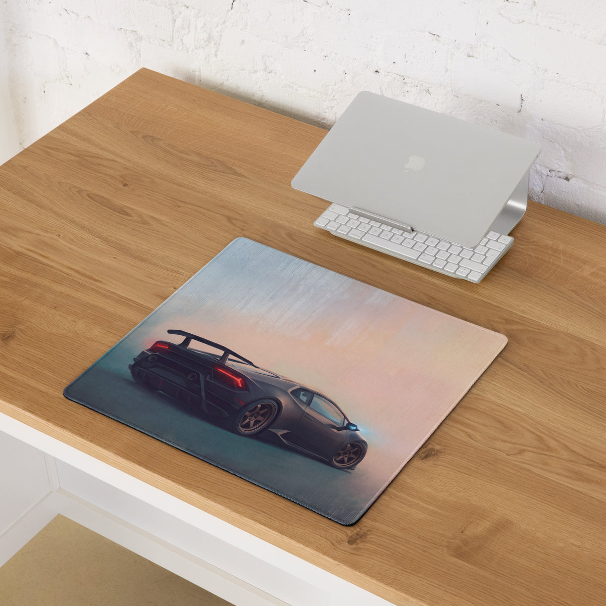 Rectangular stealth bronze desk mat featuring a dark gray lamborghini huracán with red taillights against gradient sky