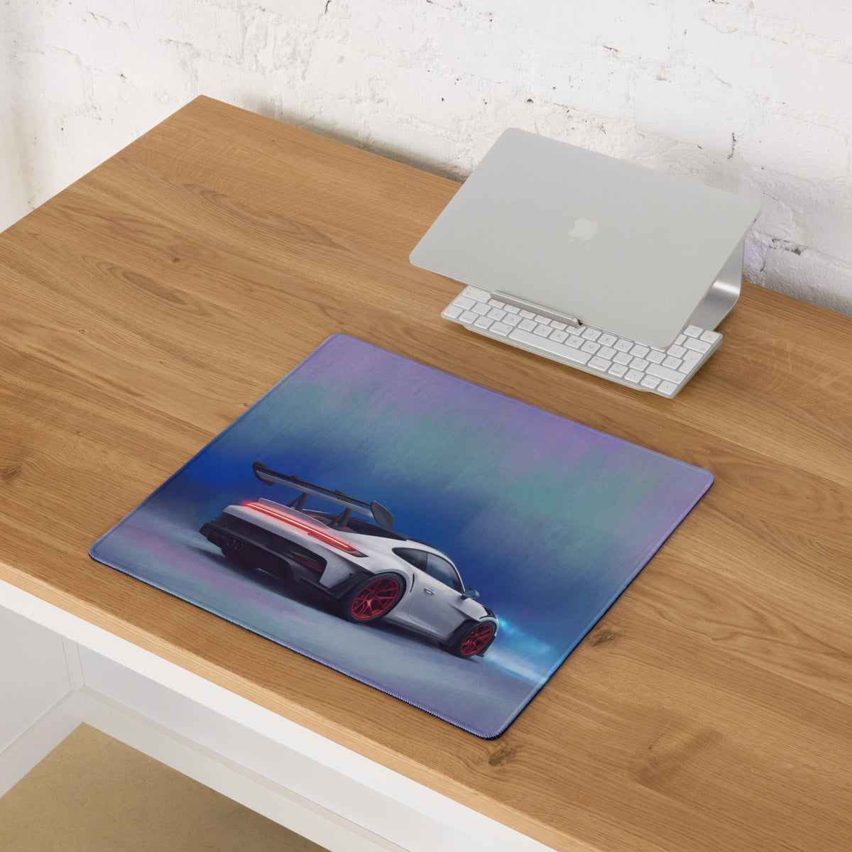 Rectangular ultra-glide stitched edge gaming mouse pad with white porsche 911 gt3 rs inspired car and red accents on blue-purple background