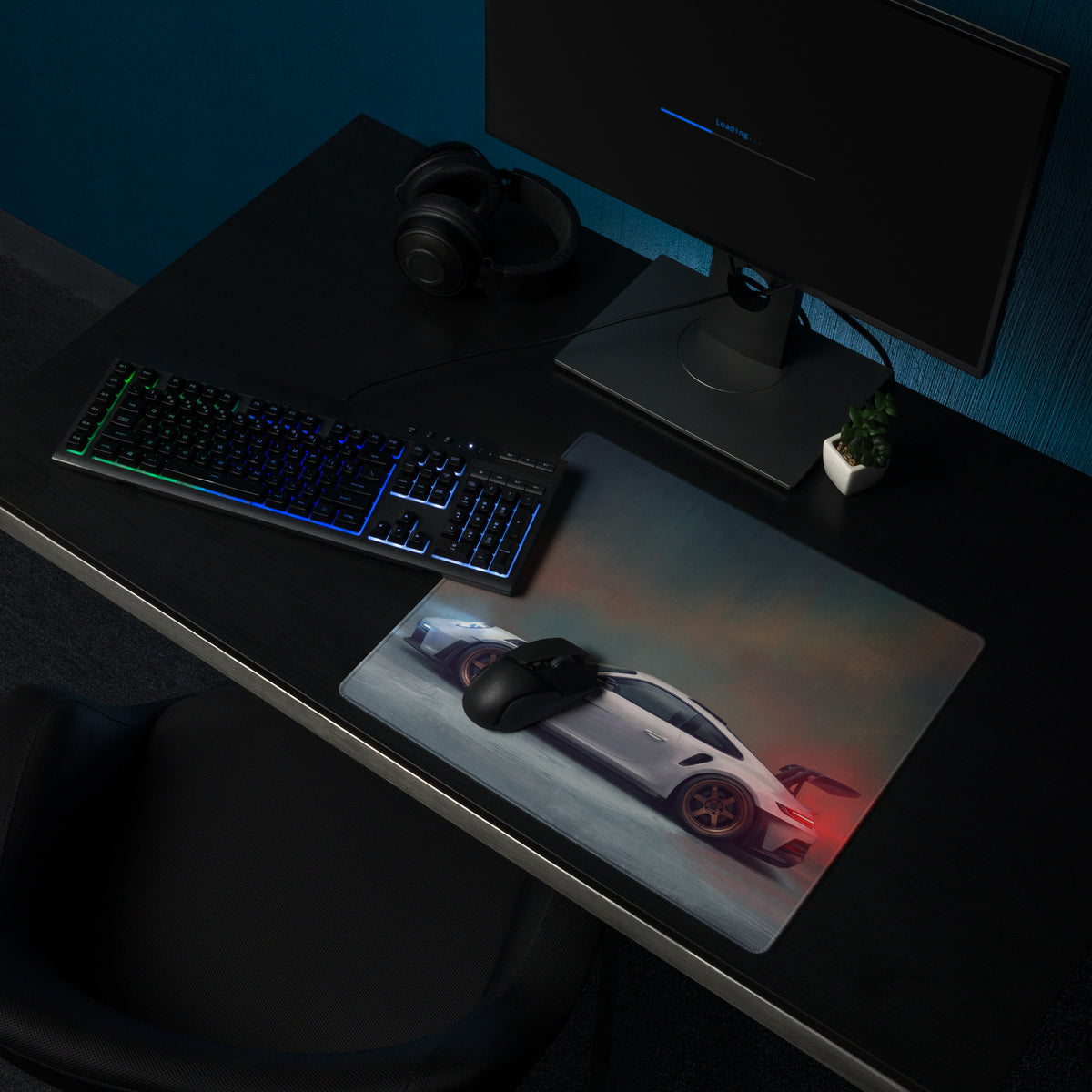 A sleek rectangular non-slip gaming mousepad featuring a white porsche 911 gt3 rs with red accents and black wheels