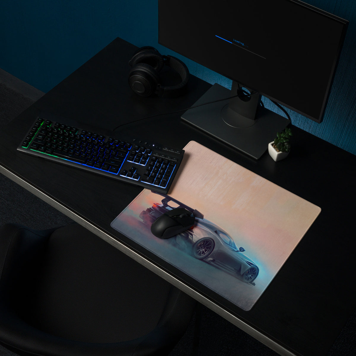 Aston Martin Vulcan inspired gunmetal apex desk pad with ultra-glide stitched edge featuring silver sports car graphic