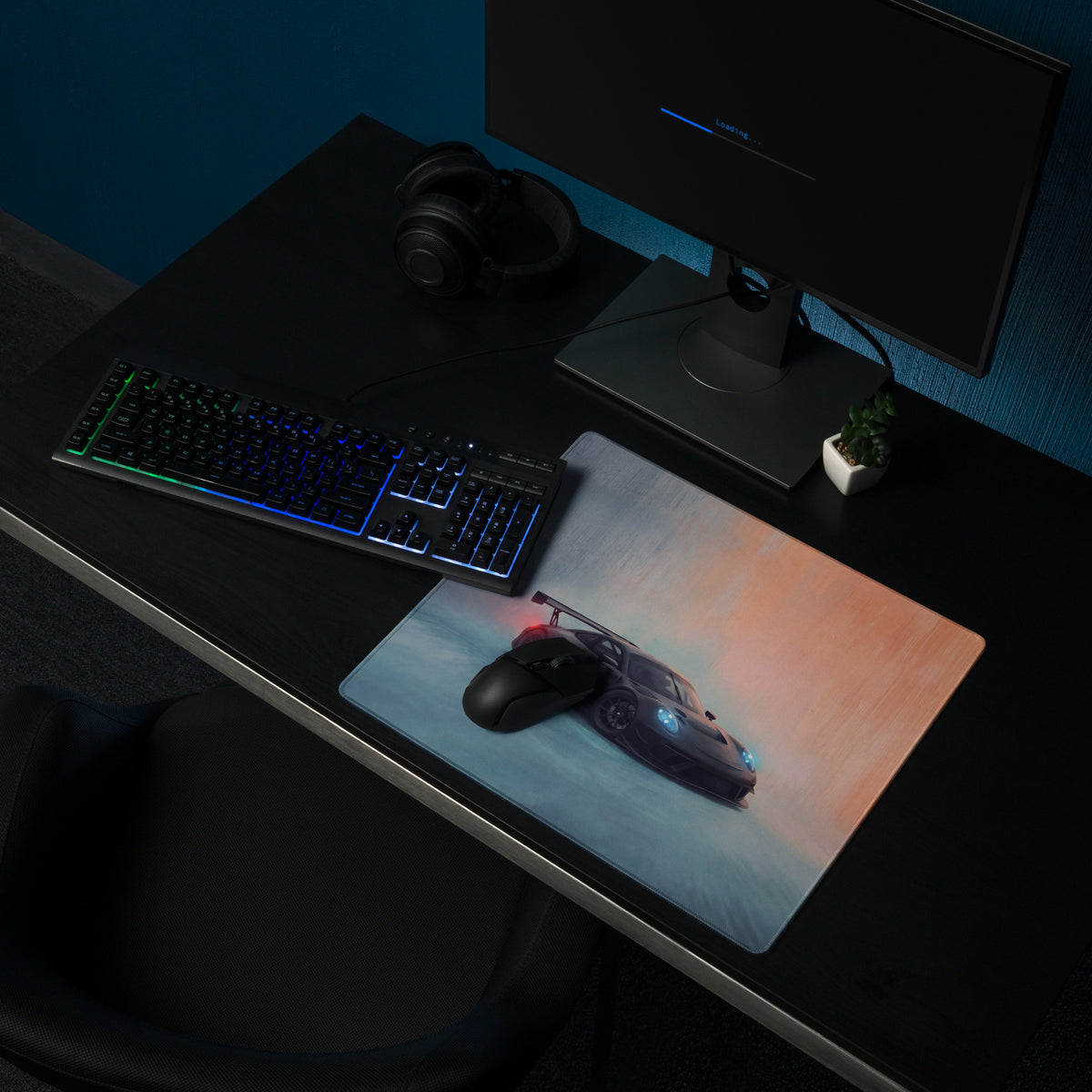 Sleek rectangular low friction cloth gaming mousepad with black porsche 911 gt3 graphic and glowing blue headlights