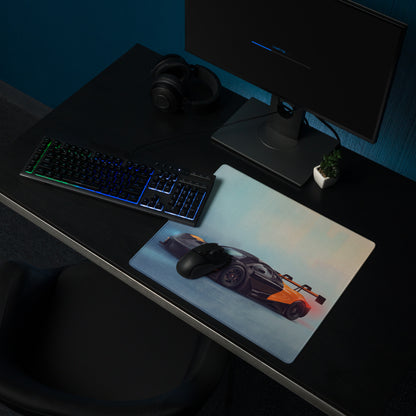 A sleek rectangular low-friction cloth gaming mousepad featuring a black and orange McLaren 720S GT3 sports car graphic