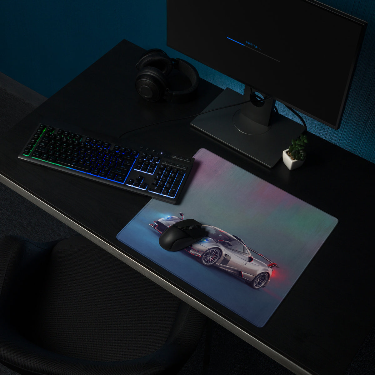 A sleek xl gaming mousepad featuring a vibrant silver pagani huayra graphic with glowing blue and red accents