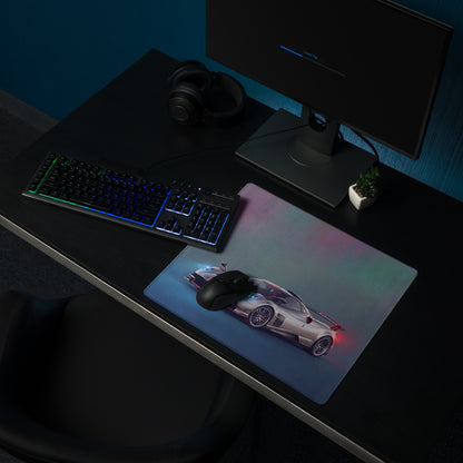 A sleek xl gaming mousepad featuring a vibrant silver pagani huayra graphic with glowing blue and red accents