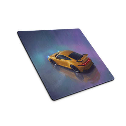 Golden sports car illustration on a speed yellow stitched edge gaming mouse mat with purple blue gradient background