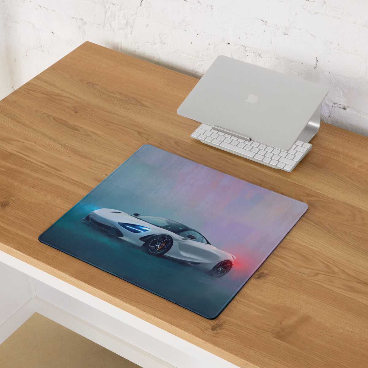 White mclaren sports car graphic on a rectangular pearl glacier desk pad with blue and purple gradient background