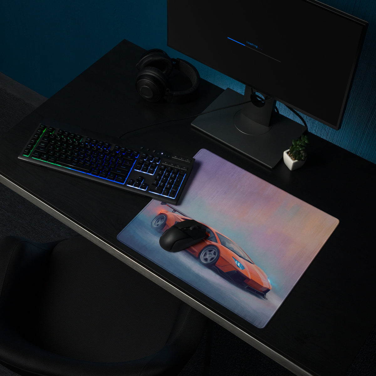 Rectangular orange sports car graphic laminated desk pad with stitched edge designed for ultra-glide gaming use