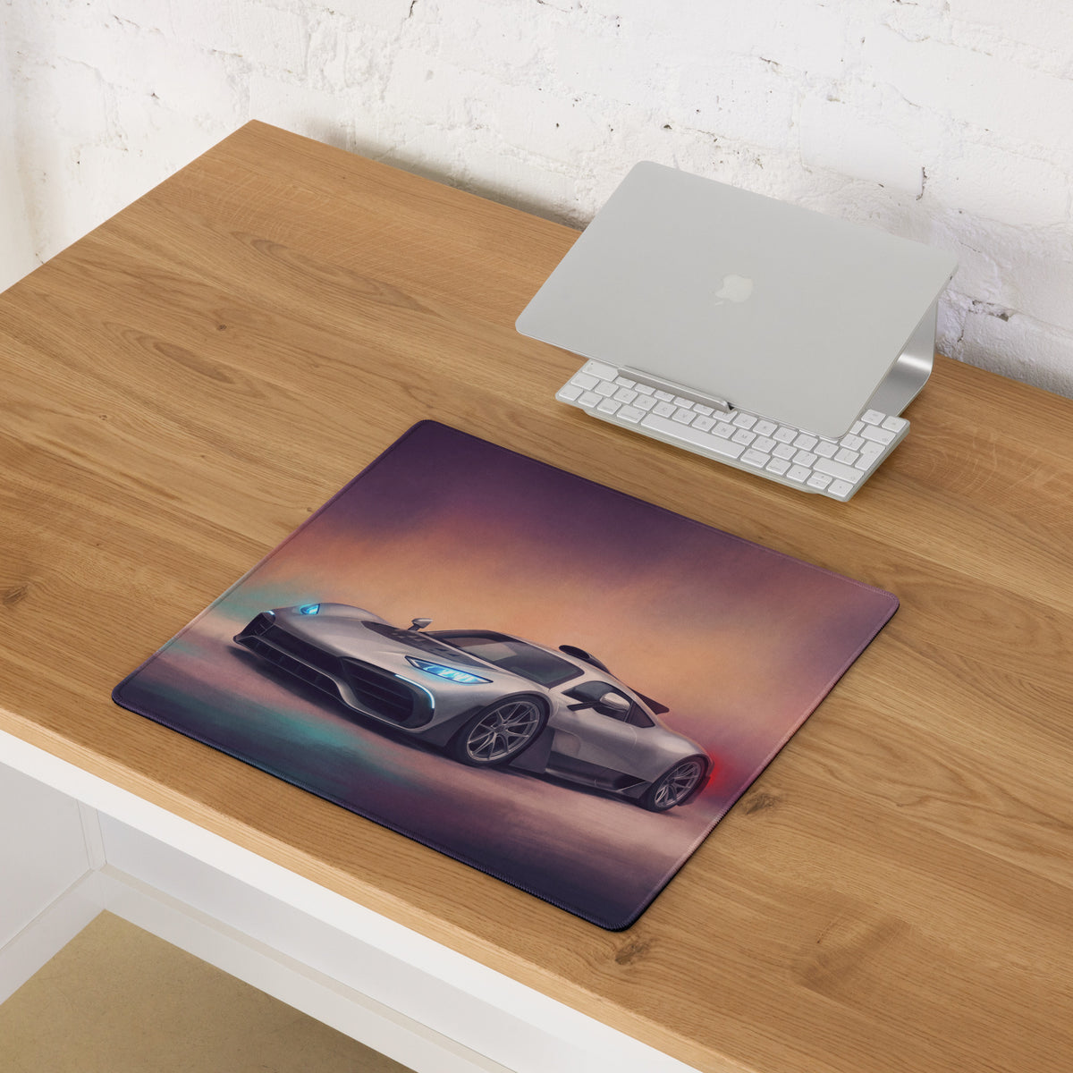 Mercedes-AMG ONE inspired hyper silver extended non-slip desk pad with silver sports car illustration and vibrant sky background