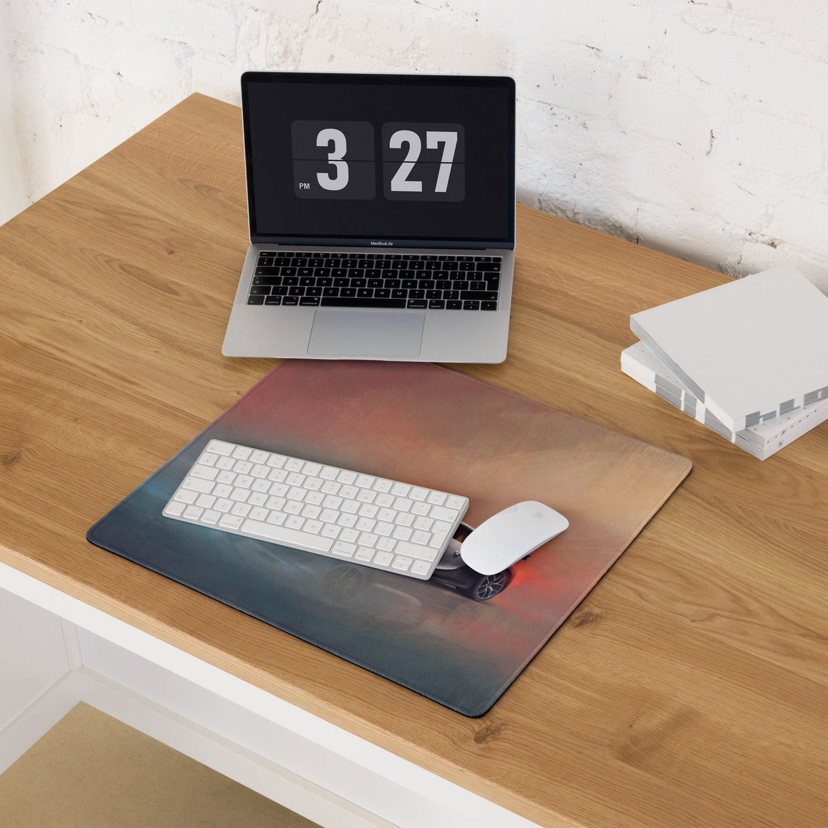 A sleek rectangular bugatti chiron inspired glacier sunset desk mat with a blue to orange gradient and black car image