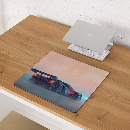 Rectangular ford gt inspired cobalt track desk pad with futuristic blue and orange race car design on pink to gray gradient