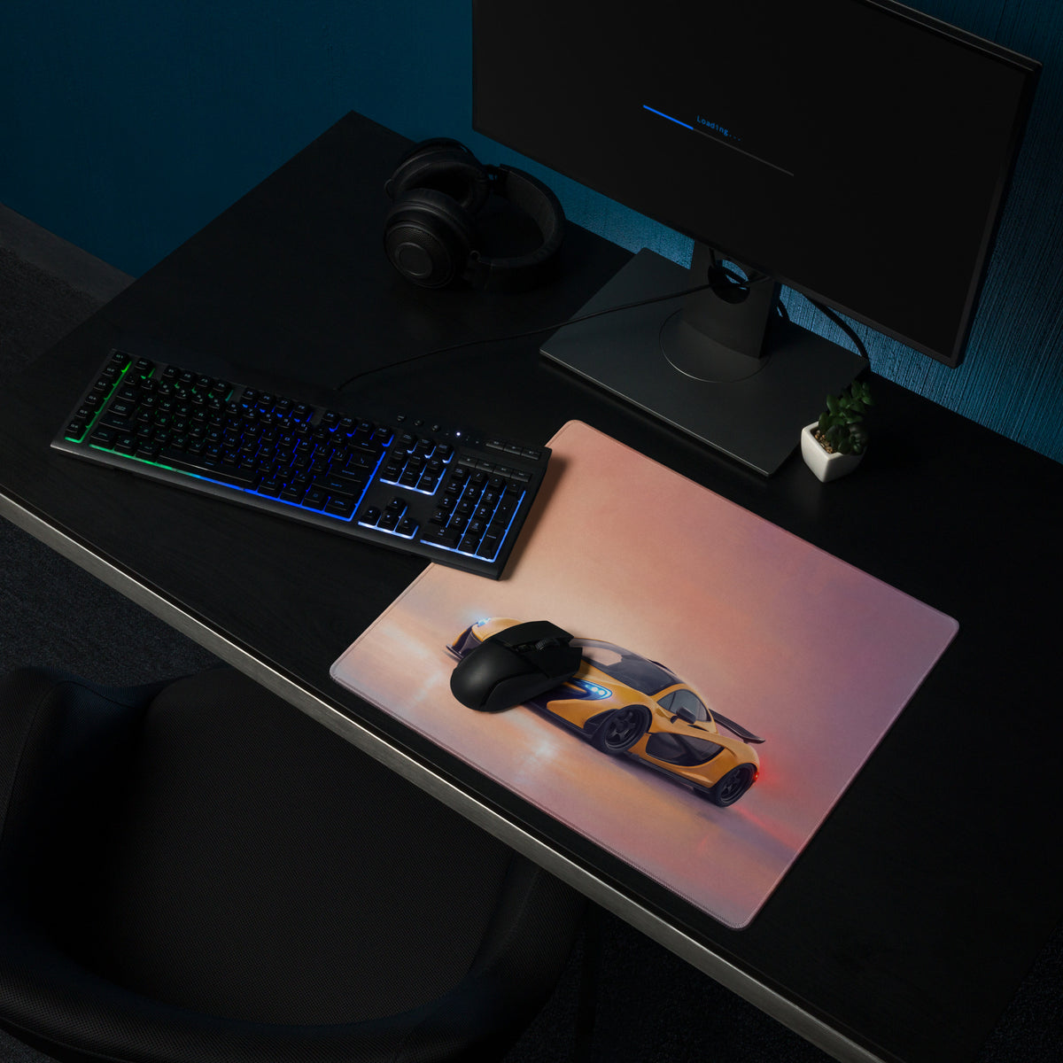 A sleek rectangular low-friction cloth gaming mousepad with vibrant yellow and black mclaren p1 sports car design