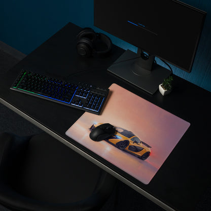 A sleek rectangular low-friction cloth gaming mousepad with vibrant yellow and black mclaren p1 sports car design