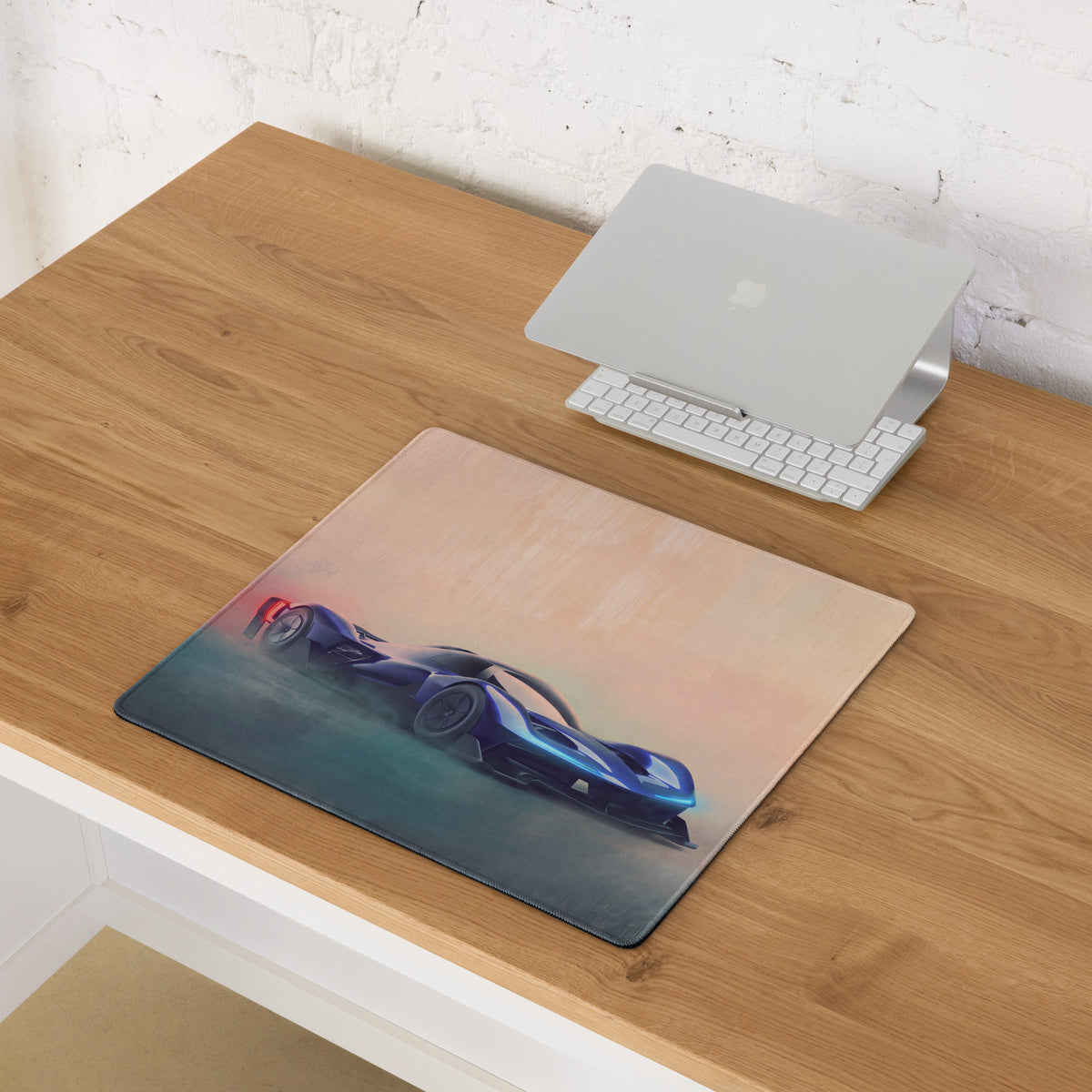 Blue futuristic race car graphic on an extended non-slip sapphire hyper desk pad mouse mat