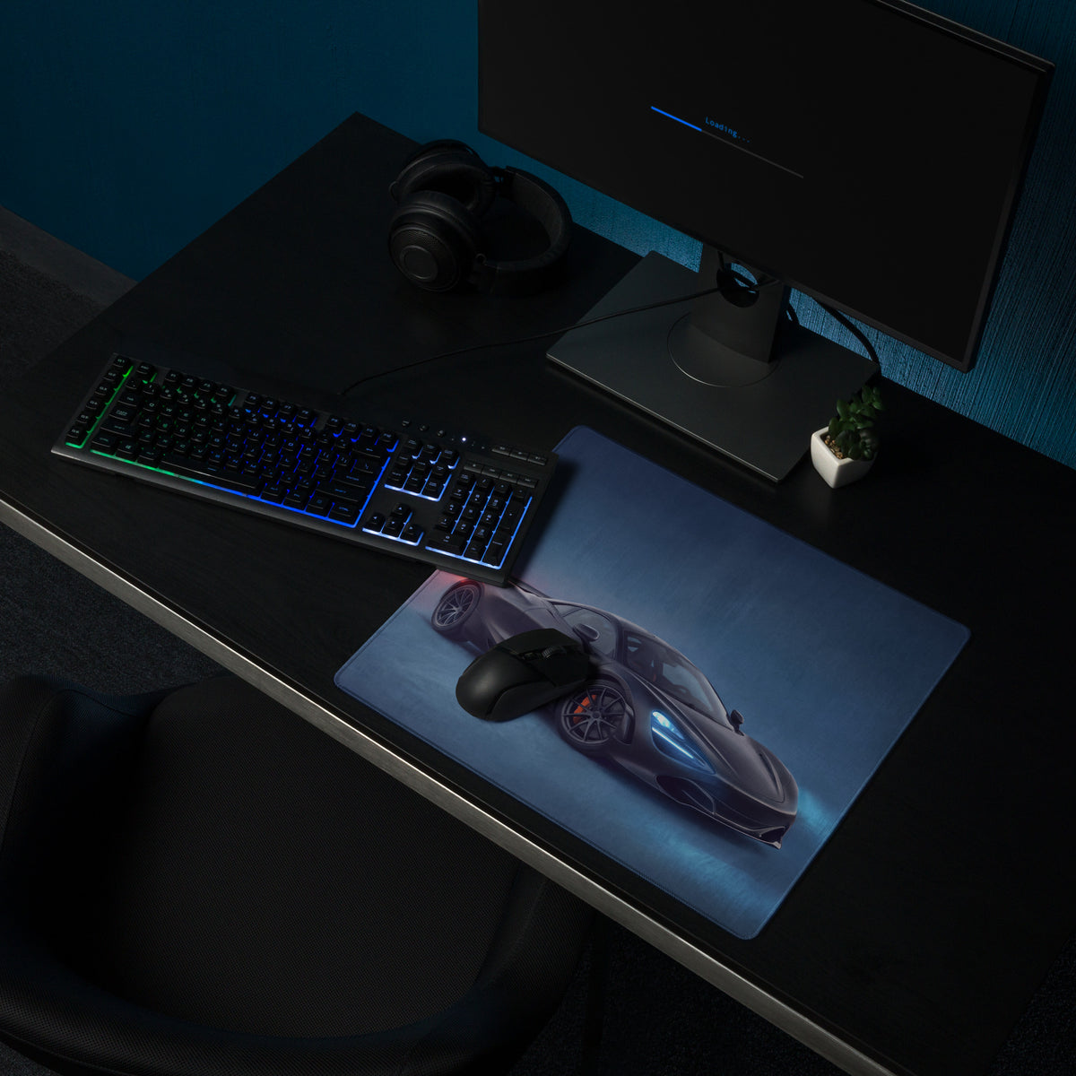 A sleek dark gray xl gaming mousepad featuring a high resolution print of a futuristic mclaren 720s sports car