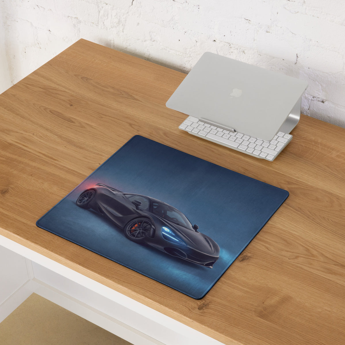 Dark blue rectangular high-precision gaming mousepad featuring a black sports car graphic with glowing headlights and red taillights