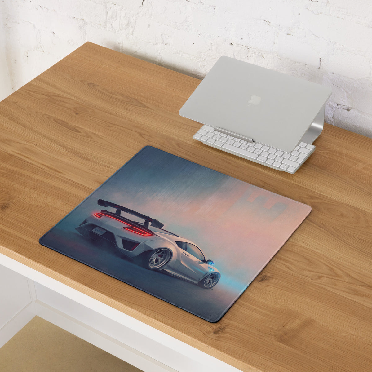 Acura nsx inspired pearl widebody desk pad featuring a sleek silver sports car with glowing red taillights on a gradient sky background